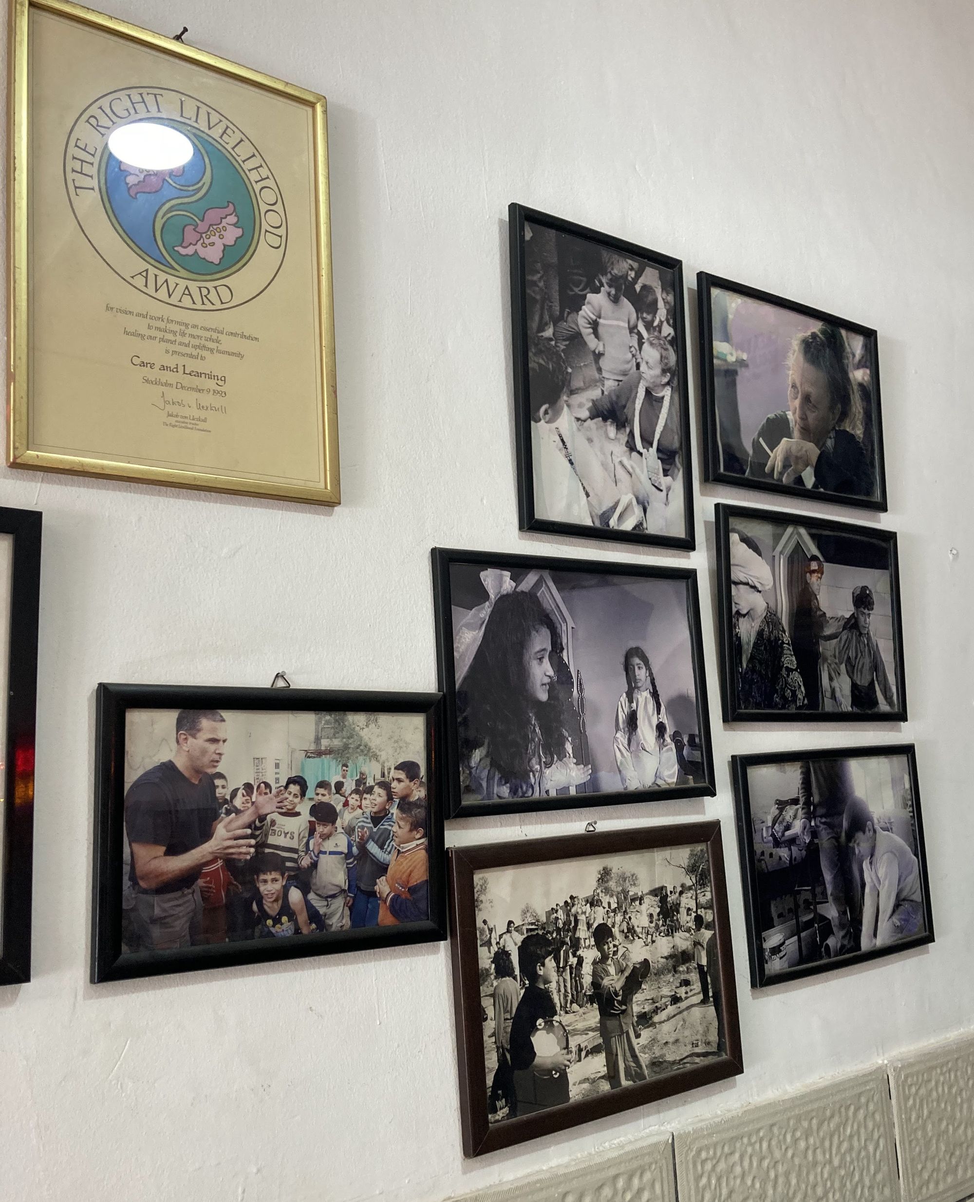 Photos on the entrance walls, on the top right Arna Mer smoking a cigarette © Noor Shihadeh