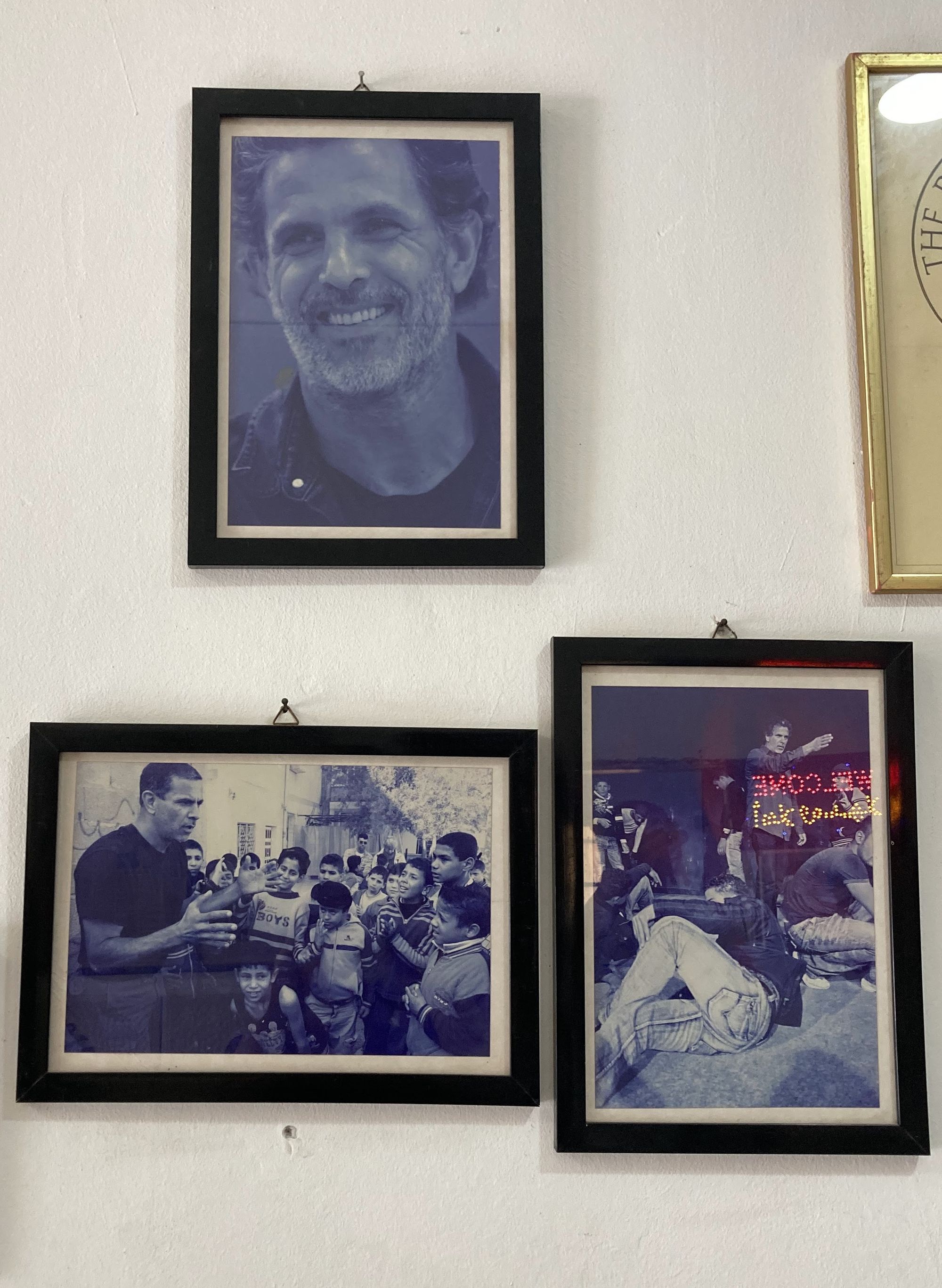 Photos of Juliano Mer Khamis posted at the entrance    © Noor Shihadeh